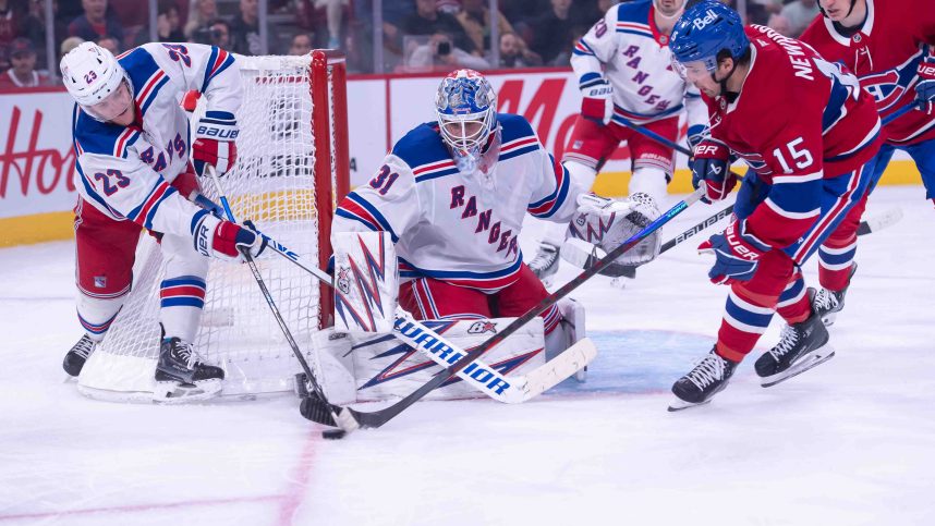 Oct 22, 2024; Ottawa, Ontario, CAN; New York Rangers defenseman Adam Fox (23) battles with Montreal Canadiens center Alex Newhook (15) for control of the puck in the second period at the Bell Centre. Mandatory Credit: Marc DesRosiers-Imagn Images