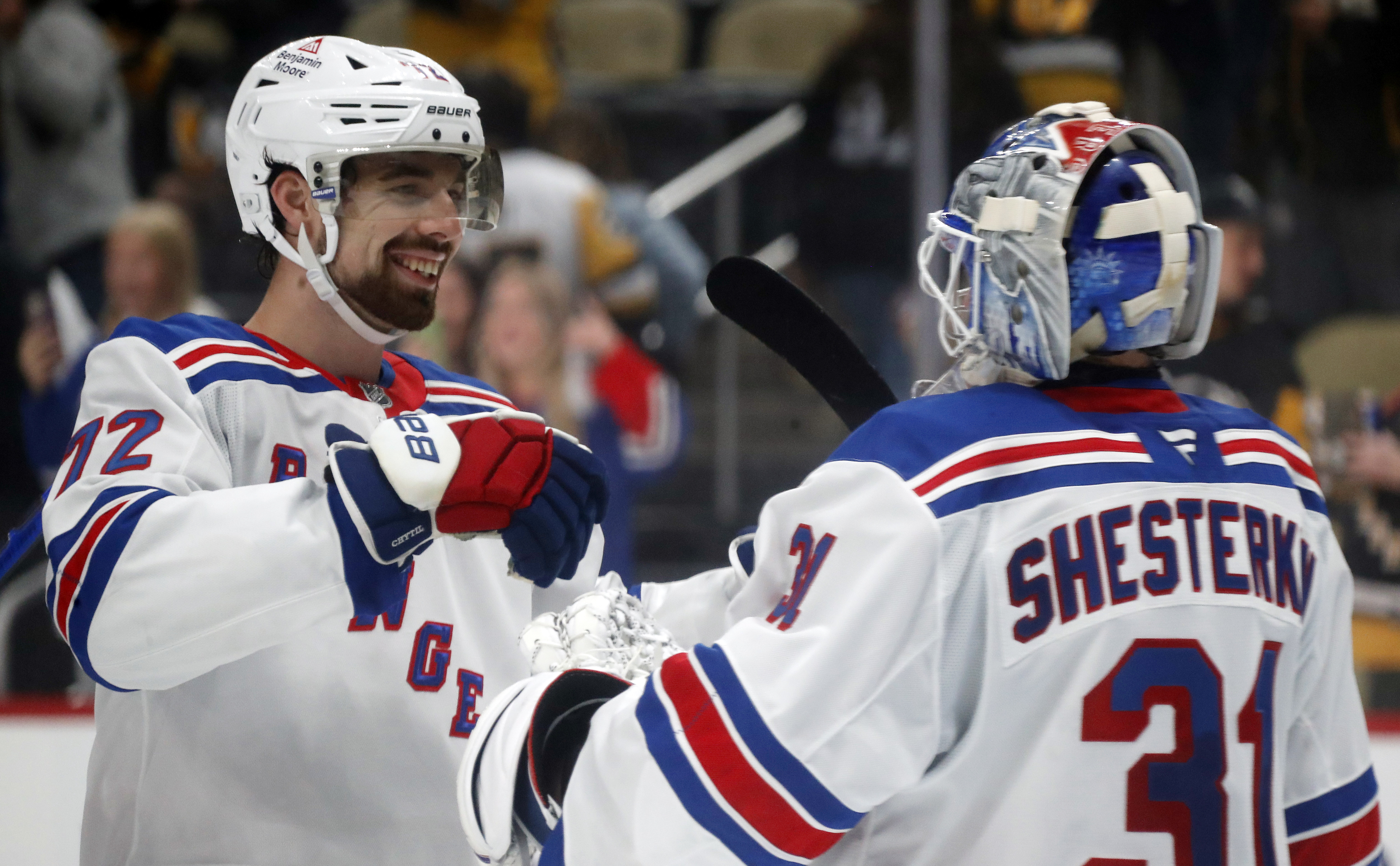 Oct 9, 2024; Pittsburgh, Pennsylvania, USA;  New York Rangers center Filip Chytil (72) and goaltender Igor Shesterkin (31) celebrate after defeating the Pittsburgh Penguins at PPG Paints Arena. Mandatory Credit: Charles LeClaire-Imagn Images