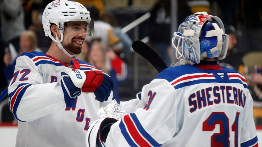 Oct 9, 2024; Pittsburgh, Pennsylvania, USA;  New York Rangers center Filip Chytil (72) and goaltender Igor Shesterkin (31) celebrate after defeating the Pittsburgh Penguins at PPG Paints Arena. Mandatory Credit: Charles LeClaire-Imagn Images