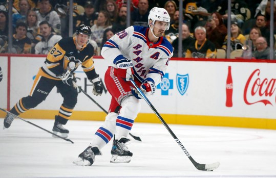 Oct 9, 2024; Pittsburgh, Pennsylvania, USA;  New York Rangers left wing Chris Kreider (20) skates up ice with he puck against the Pittsburgh Penguins during the second period at PPG Paints Arena. Mandatory Credit: Charles LeClaire-Imagn Images