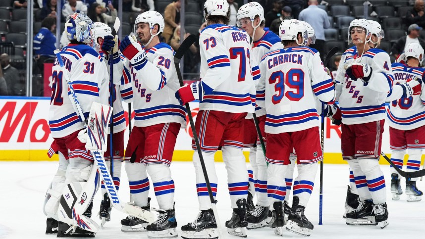 Oct 19, 2024; Toronto, Ontario, CAN; New York Rangers goaltender Igor Shesterkin (31) celebrates with left wing Chris Kreider (20) after defeating the Toronto Maple Leafs at Scotiabank Arena. Mandatory Credit: Nick Turchiaro-Imagn Images