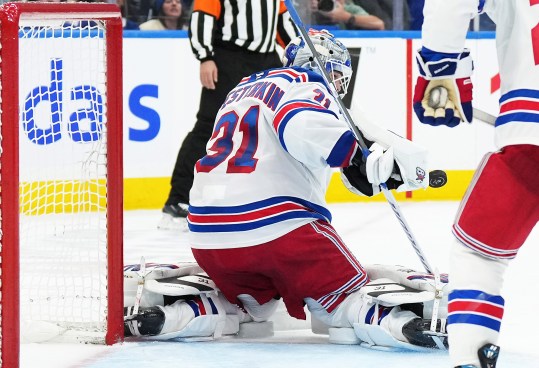 Oct 19, 2024; Toronto, Ontario, CAN; New York Rangers goaltender Igor Shesterkin (31) stops the puck against the Toronto Maple Leafs during the third period at Scotiabank Arena. Mandatory Credit: Nick Turchiaro-Imagn Images