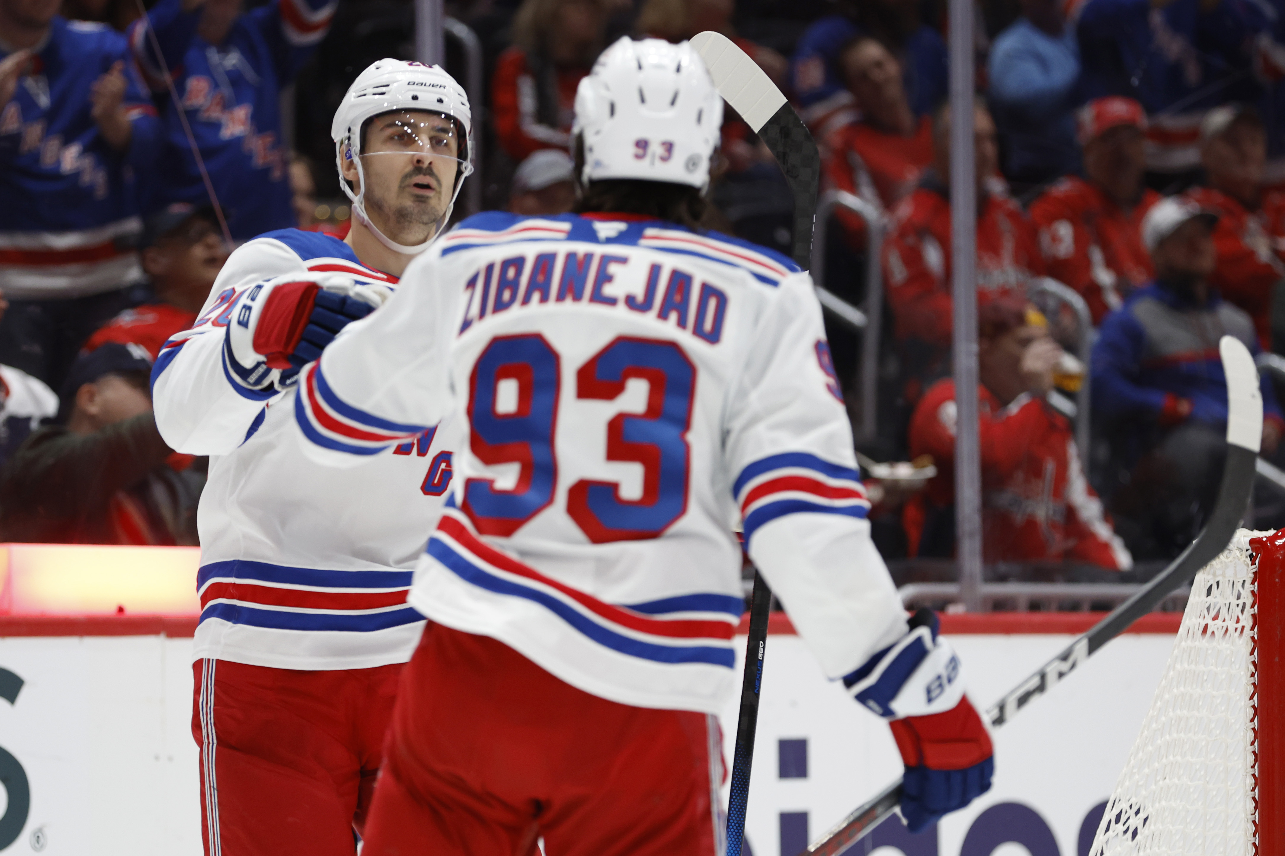 Oct 29, 2024; Washington, District of Columbia, USA; New York Rangers left wing Chris Kreider (20) celebrates with Rangers center Mika Zibanejad (93) after scoring a goal against the Washington Capitals in the second period at Capital One Arena. Mandatory Credit: Geoff Burke-Imagn Images