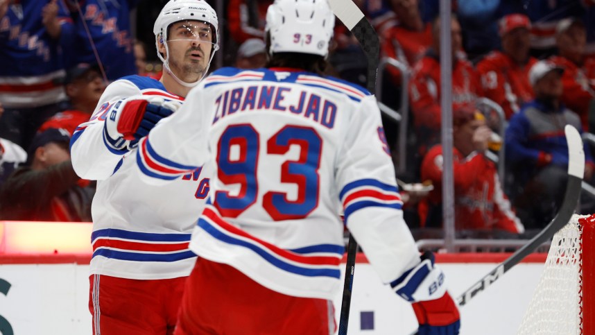 Oct 29, 2024; Washington, District of Columbia, USA; New York Rangers left wing Chris Kreider (20) celebrates with Rangers center Mika Zibanejad (93) after scoring a goal against the Washington Capitals in the second period at Capital One Arena. Mandatory Credit: Geoff Burke-Imagn Images