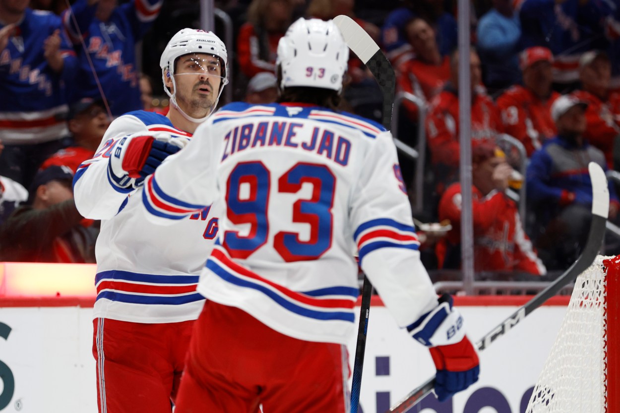 Oct 29, 2024; Washington, District of Columbia, USA; New York Rangers left wing Chris Kreider (20) celebrates with Rangers center Mika Zibanejad (93) after scoring a goal against the Washington Capitals in the second period at Capital One Arena. Mandatory Credit: Geoff Burke-Imagn Images