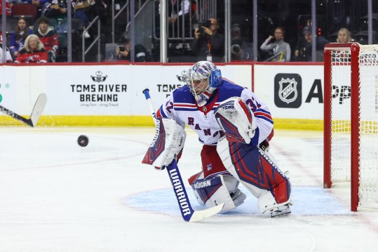 Sep 30, 2024; Newark, New Jersey, USA; New York Rangers goaltender Jonathan Quick (32) makes a save against the New Jersey Devils during the second period at Prudential Center. Mandatory Credit: Ed Mulholland-Imagn Images