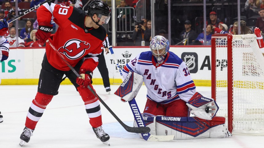 Sep 30, 2024; Newark, New Jersey, USA; New York Rangers goaltender Jonathan Quick (32) makes a save against New Jersey Devils left wing Mike Hardman (39) during the second period at Prudential Center. Mandatory Credit: Ed Mulholland-Imagn Images