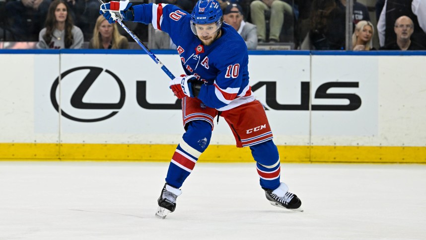 May 30, 2024; New York, New York, USA; New York Rangers left wing Artemi Panarin (10) lines up a shot against the Florida Panthers during the first period in game five of the Eastern Conference Final of the 2024 Stanley Cup Playoffs at Madison Square Garden. Mandatory Credit: Dennis Schneidler-Imagn Images