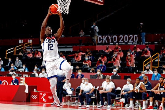 Aug 7, 2021; Saitama, Japan; United States guard Jrue Holiday (12) dunks the ball against France in the men's basketball gold medal game during the Tokyo 2020 Olympic Summer Games at Saitama Super Arena. Mandatory Credit: Geoff Burke-Imagn Images