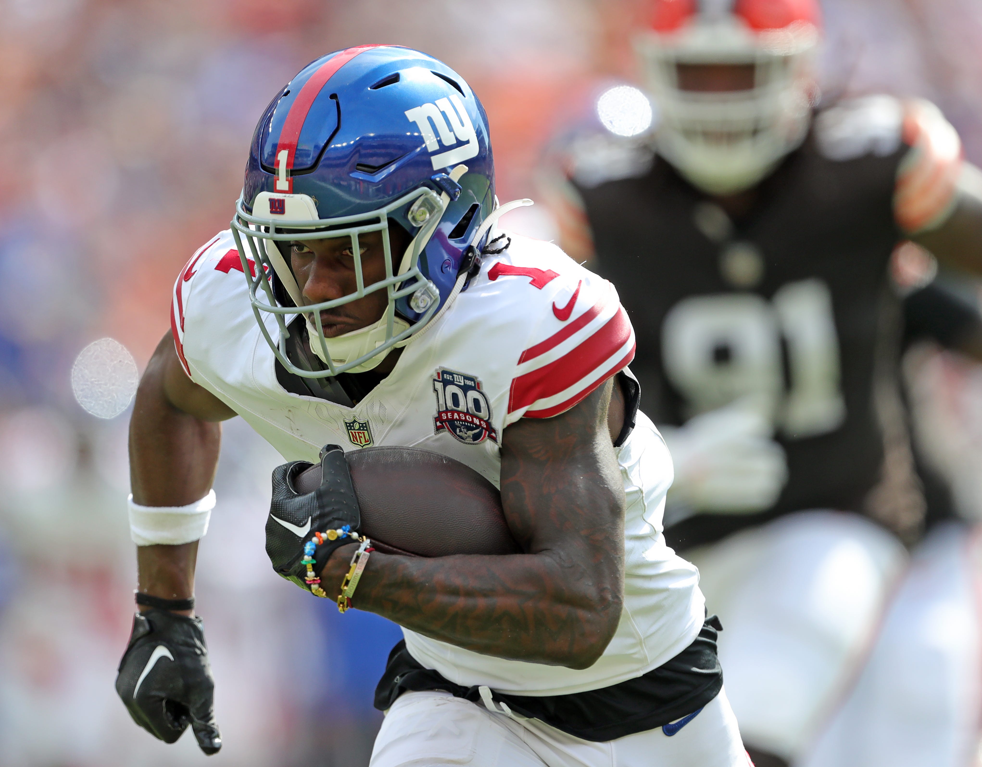 New York Giants wide receiver Malik Nabers (1) runs for yards after a catch during the first half of an NFL football game at Huntington Bank Field, Sunday, Sept. 22, 2024, in Cleveland, Ohio.