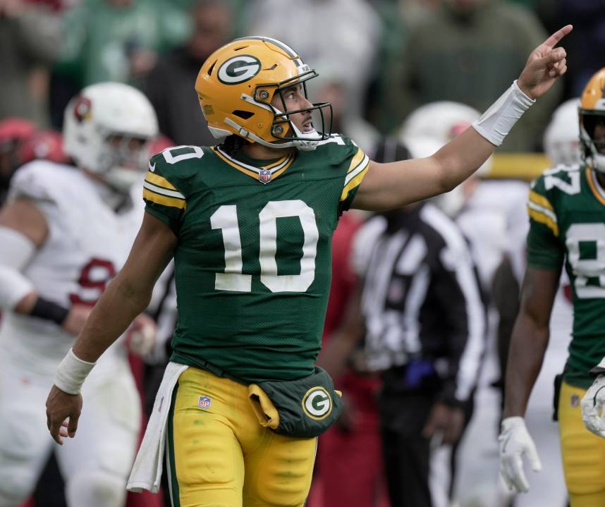 Green Bay Packers quarterback Jordan Love (10) signals first down during the fourth quarter of their game Sunday, October 13, 2024 at Lambeau Field in Green Bay, Wisconsin. The Green Bay Packers beat the Arizona Cardinals 34-13.