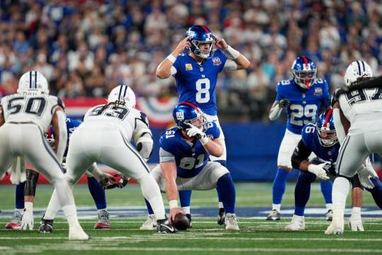 Sep 26, 2024; East Rutherford, NJ, US; New York Giants quarterback Daniel Jones (8) calls a play from behind New York Giants center John Michael Schmitz Jr. (61) at MetLife Stadium. Mandatory Credit: Julian Guadalupe-NorthJersey.com