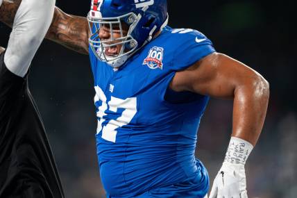 Sep 26, 2024; East Rutherford, NJ, US; New York Giants defensive tackle Dexter Lawrence II (97) celebrates with his coach during pre-game at MetLife Stadium. Mandatory Credit: Julian Guadalupe-NorthJersey.com