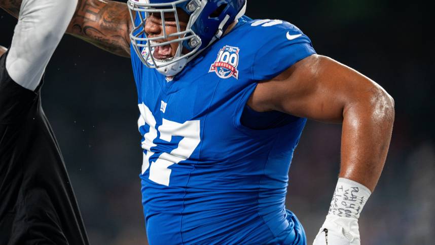 Sep 26, 2024; East Rutherford, NJ, US; New York Giants defensive tackle Dexter Lawrence II (97) celebrates with his coach during pre-game at MetLife Stadium. Mandatory Credit: Julian Guadalupe-NorthJersey.com