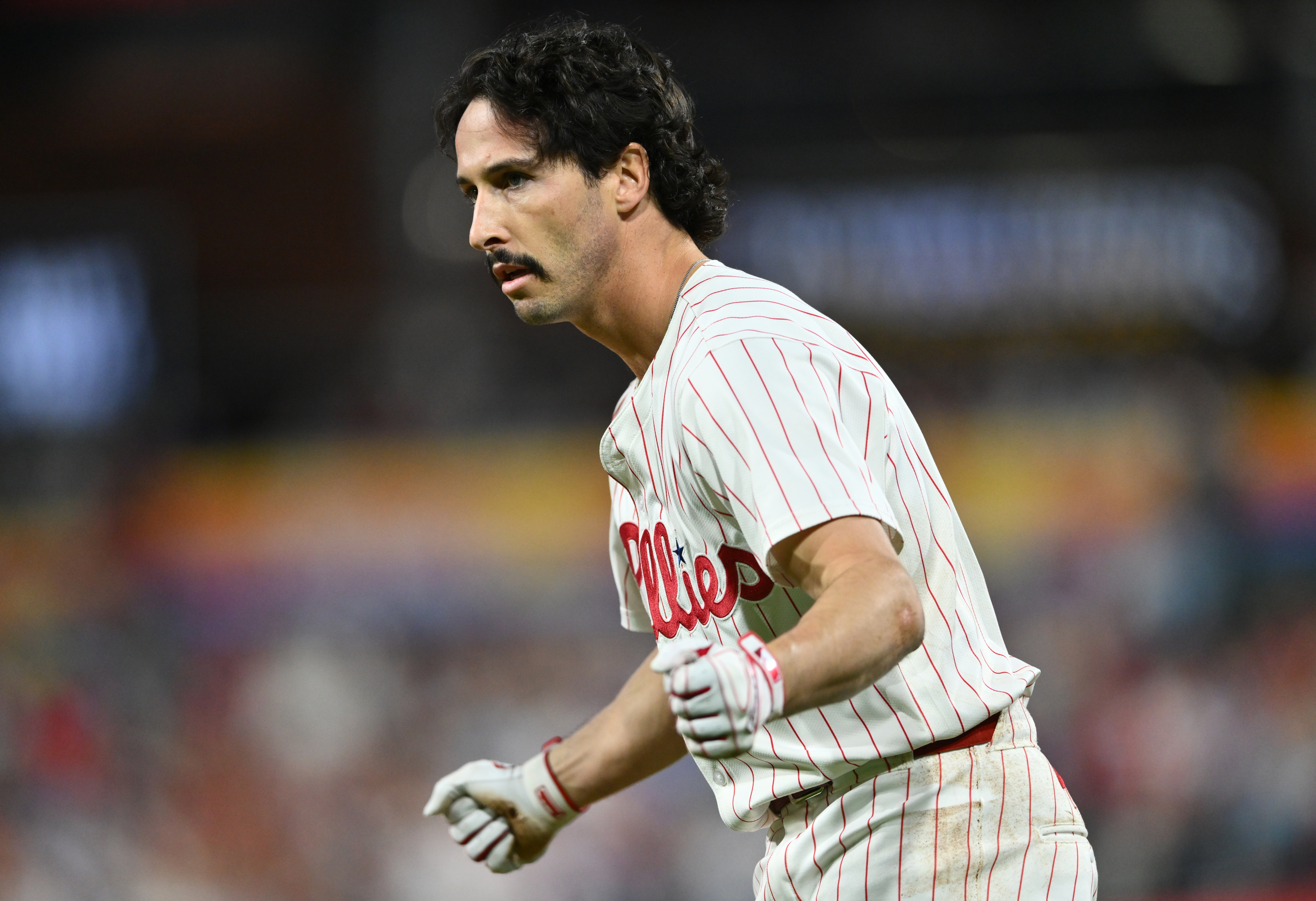 Sep 24, 2024; Philadelphia, Pennsylvania, USA; Philadelphia Phillies catcher Garrett Stubbs (21) reacts after reaching first base safely on an RBI bunt against the Chicago Cubs in the second inning at Citizens Bank Park. Mandatory Credit: Kyle Ross-Imagn Images