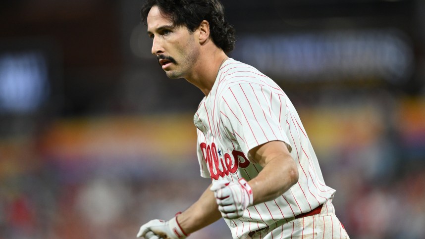 Sep 24, 2024; Philadelphia, Pennsylvania, USA; Philadelphia Phillies catcher Garrett Stubbs (21) reacts after reaching first base safely on an RBI bunt against the Chicago Cubs in the second inning at Citizens Bank Park. Mandatory Credit: Kyle Ross-Imagn Images