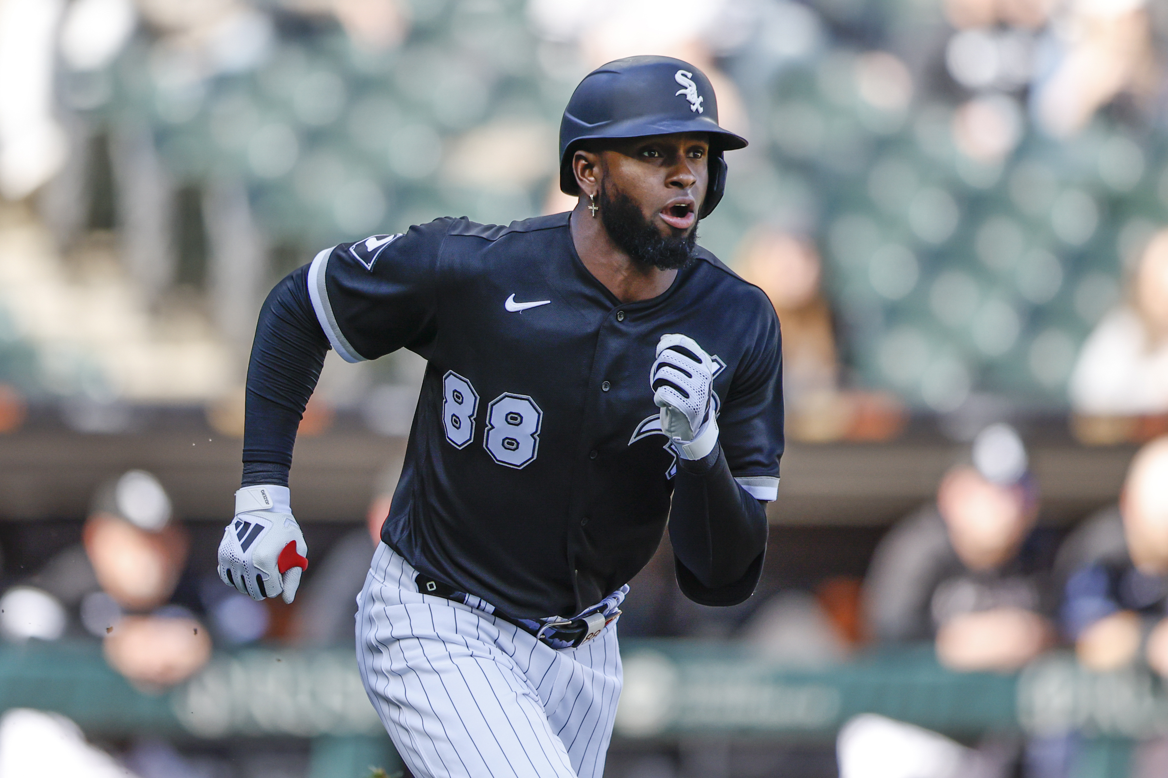 Apr 18, 2023; Chicago, Illinois, USA; Chicago White Sox center fielder Luis Robert Jr. (88) runs to second base after hitting a two-run double against the Philadelphia Phillies during the third inning of game one of the doubleheader at Guaranteed Rate Field. Mandatory Credit: Kamil Krzaczynski-Imagn Images