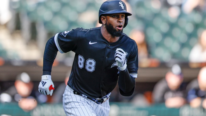 Apr 18, 2023; Chicago, Illinois, USA; Chicago White Sox center fielder Luis Robert Jr. (88) runs to second base after hitting a two-run double against the Philadelphia Phillies during the third inning of game one of the doubleheader at Guaranteed Rate Field. Mandatory Credit: Kamil Krzaczynski-Imagn Images