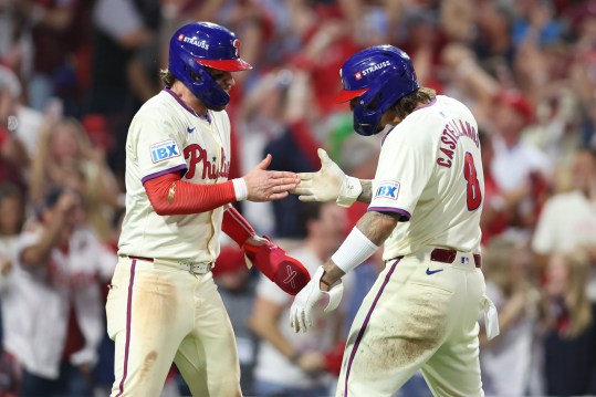 Oct 6, 2024; Philadelphia, Pennsylvania, USA; Philadelphia Phillies outfielder Nick Castellanos (8) and first base Bryce Harper (3) celebrate after scoring a run in the eighth inning against the New York Mets during game two of the NLDS for the 2024 MLB Playoffs at Citizens Bank Park. Mandatory Credit: Bill Streicher-Imagn Images