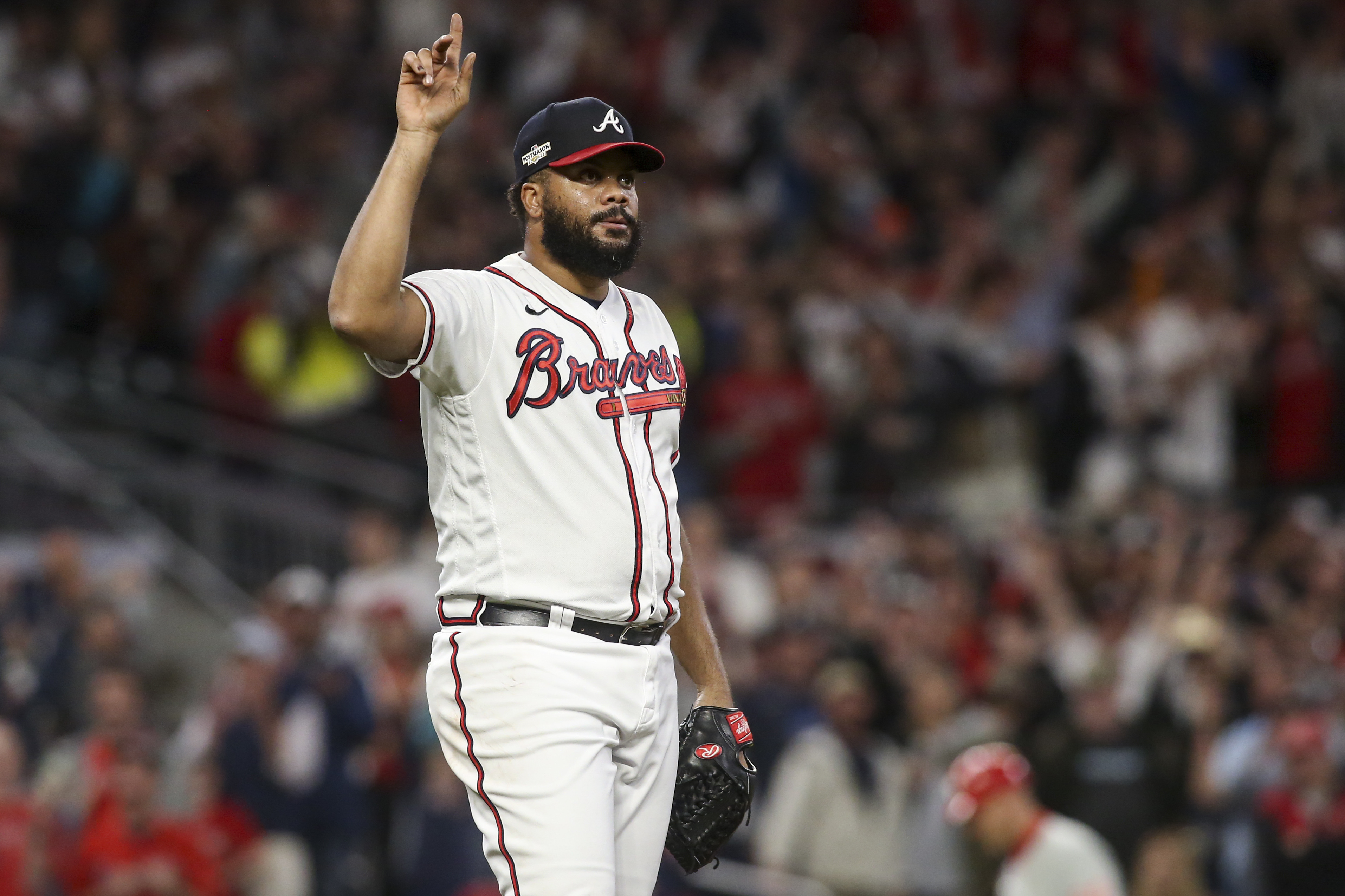 Oct 12, 2022; Atlanta, Georgia, USA; Atlanta Braves relief pitcher Kenley Jansen (74) points skyward on a ball hit for the final out against the Philadelphia Phillies in the ninth inning during game two of the NLDS for the 2022 MLB Playoffs at Truist Park. Mandatory Credit: Brett Davis-Imagn Images