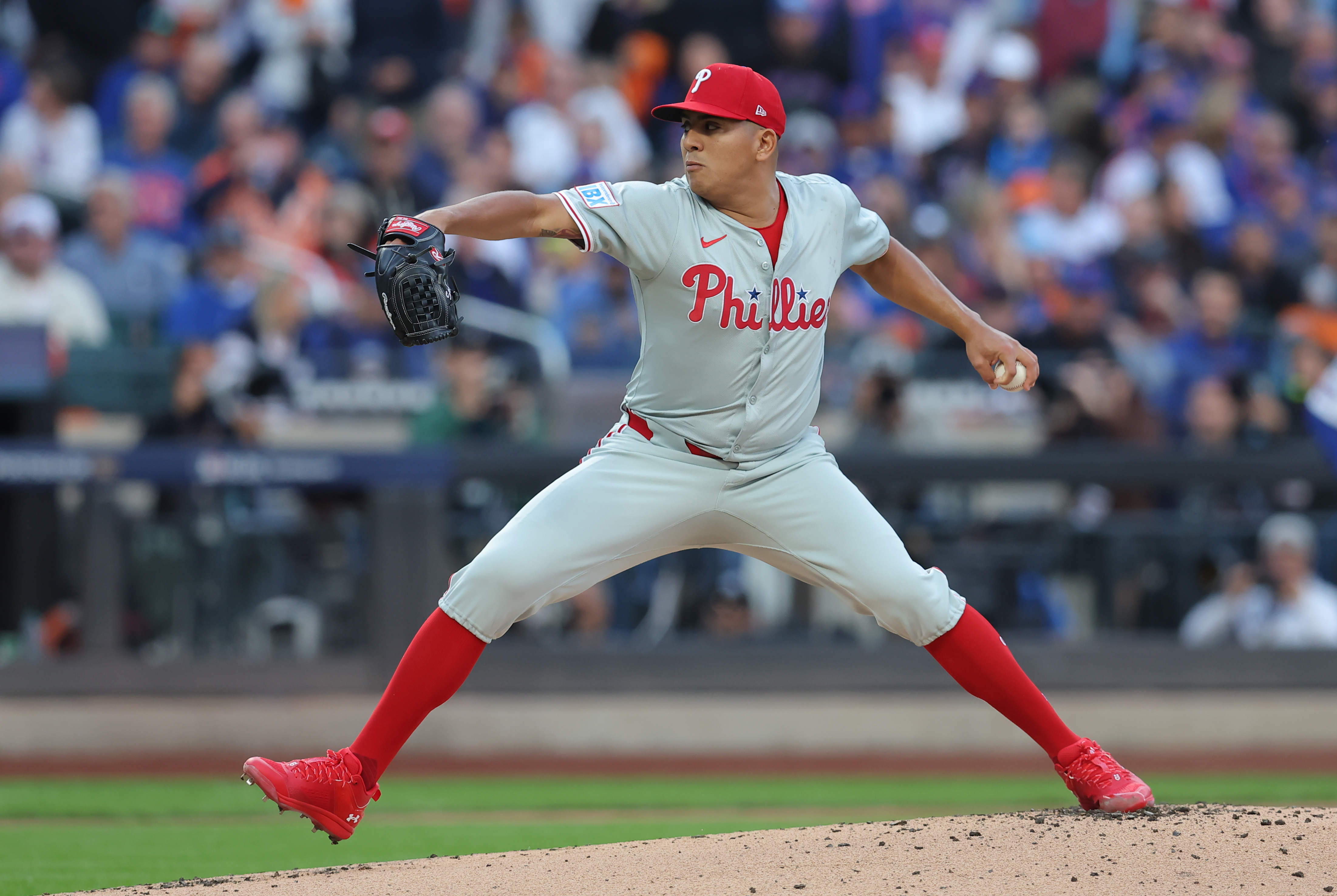 Oct 9, 2024; New York, New York, USA;  Philadelphia Phillies pitcher Ranger Suarez (55) throws a pitch against the New York Mets in the first inning in game four of the NLDS for the 2024 MLB Playoffs at Citi Field. Mandatory Credit: Brad Penner-Imagn Images