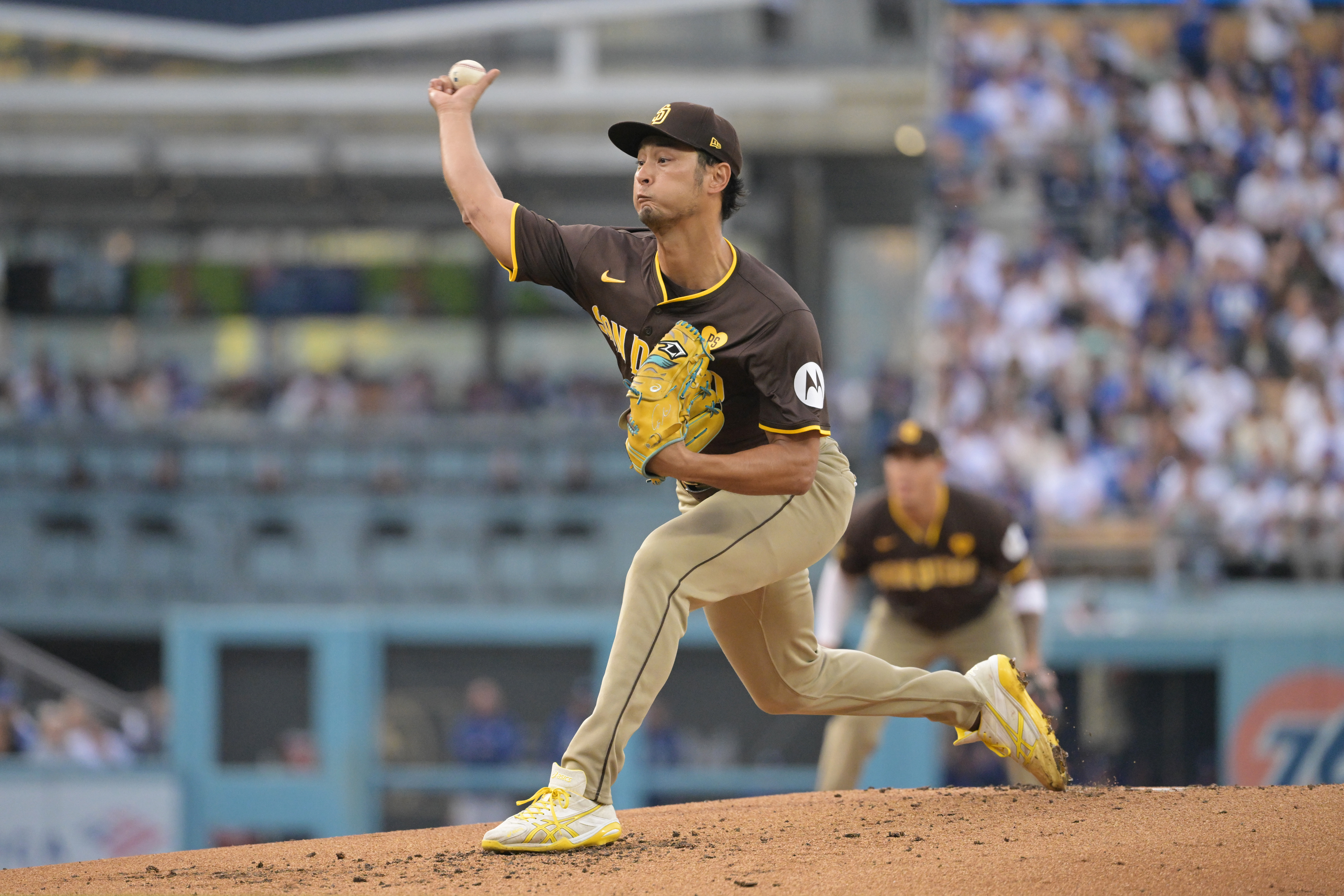 Oct 11, 2024; Los Angeles, California, USA; San Diego Padres pitcher Yu Darvish (11) pitches in the second inning against the Los Angeles Dodgers during game five of the NLDS for the 2024 MLB Playoffs at Dodger Stadium. Mandatory Credit: Jayne Kamin-Oncea-Imagn Images