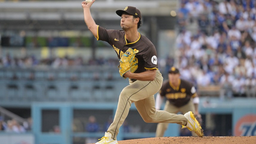 Oct 11, 2024; Los Angeles, California, USA; San Diego Padres pitcher Yu Darvish (11) pitches in the second inning against the Los Angeles Dodgers during game five of the NLDS for the 2024 MLB Playoffs at Dodger Stadium. Mandatory Credit: Jayne Kamin-Oncea-Imagn Images