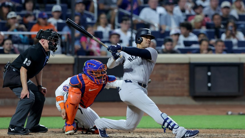 Jun 25, 2024; New York City, New York, USA; New York Yankees right fielder Juan Soto (22) follows through on a solo home run against the New York Mets during the fifth inning at Citi Field. Mandatory Credit: Brad Penner-Imagn Images