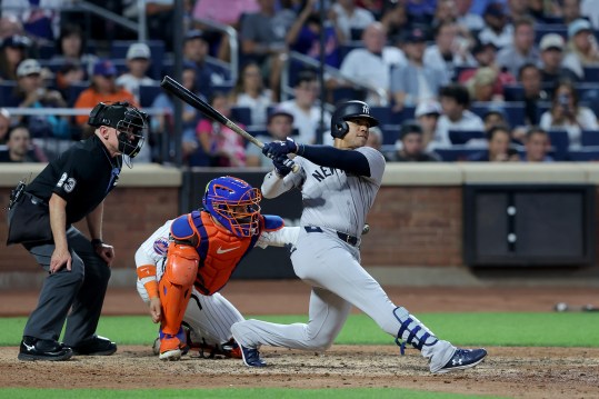 Jun 25, 2024; New York City, New York, USA; New York Yankees right fielder Juan Soto (22) follows through on a solo home run against the New York Mets during the fifth inning at Citi Field. Mandatory Credit: Brad Penner-Imagn Images