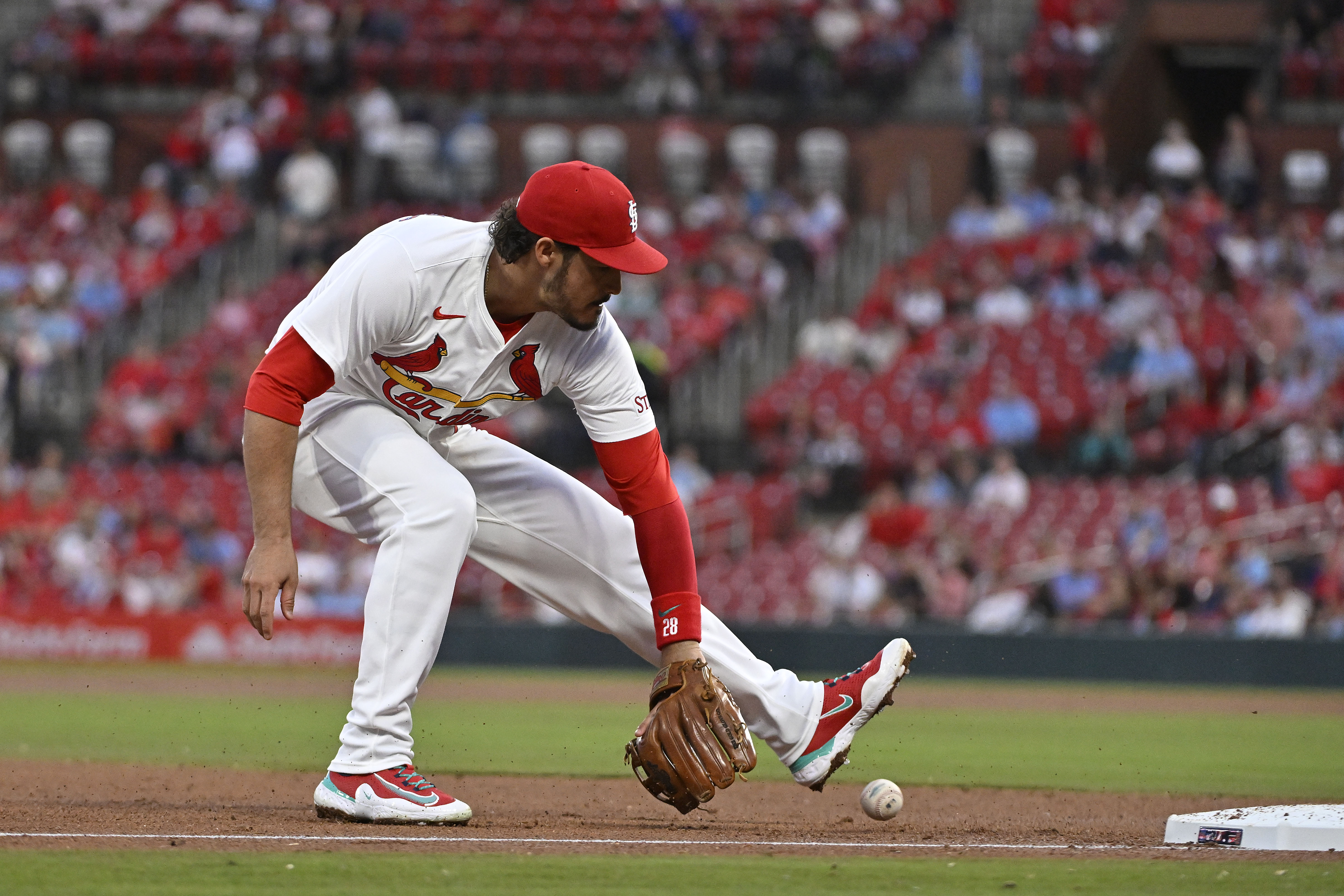 Apr 8, 2024; St. Louis, Missouri, USA;  St. Louis Cardinals third baseman Nolan Arenado (28) fields a ground ball against the Philadelphia Phillies during the fourth inning at Busch Stadium. Mandatory Credit: Jeff Curry-Imagn Images