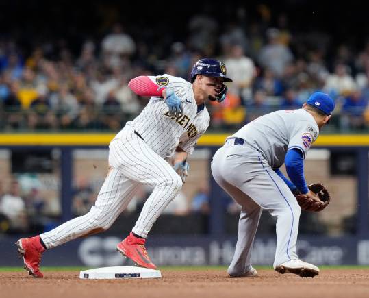 Oct 3, 2024; Milwaukee, Wisconsin, USA; Milwaukee Brewers shortstop Willy Adames (27) steals second during the fourth inning of Game 3 of National League wild-card series against New York Mets on Thursday October 3, 2024 at American Family Field in Milwaukee, Wis. Mandatory Credit: Jovanny Hernandez/USA TODAY Network via Imagn Images