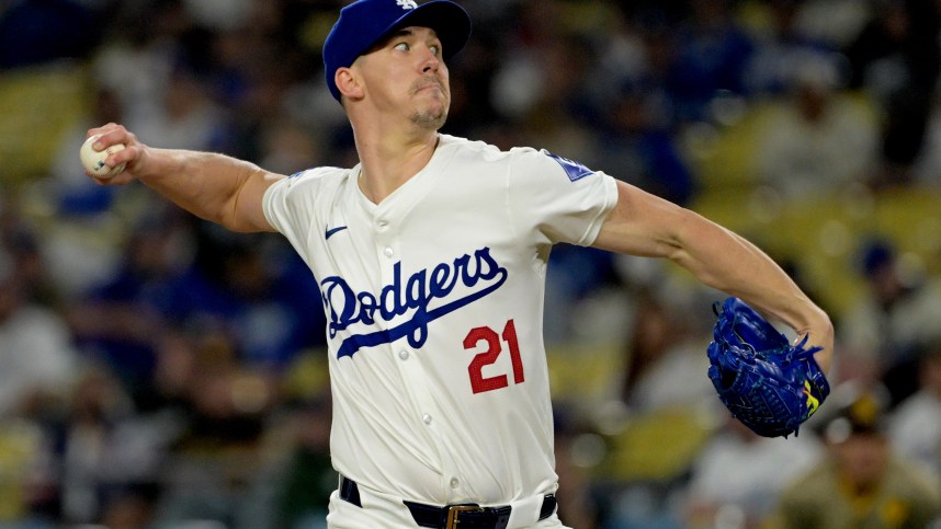 Sep 26, 2024; Los Angeles, California, USA;  Los Angeles Dodgers starting pitcher Walker Buehler (21) delivers to the plate in the first inning against the San Diego Padres at Dodger Stadium. Mandatory Credit: Jayne Kamin-Oncea-Imagn Images