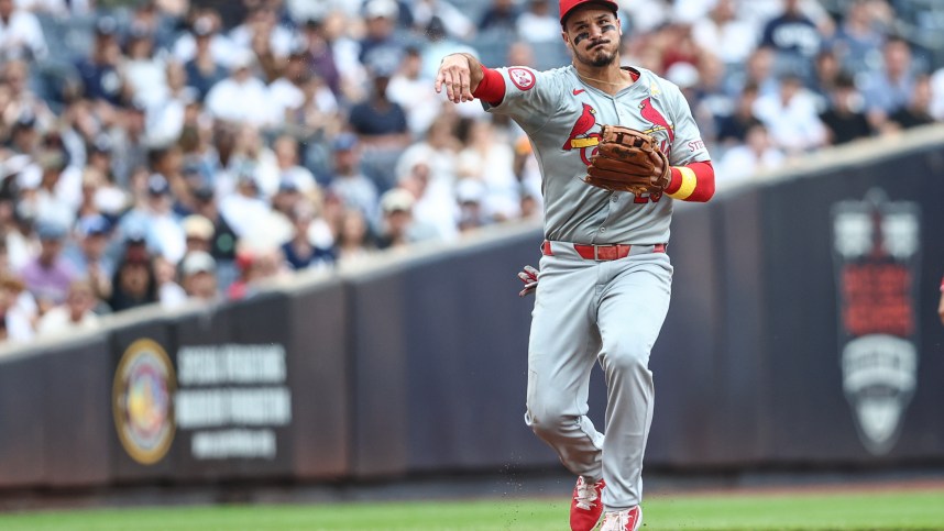 Sep 1, 2024; Bronx, New York, USA;  St. Louis Cardinals third baseman Nolan Arenado (28) throws a runner out at first base in the first inning against the New York Yankees at Yankee Stadium. Mandatory Credit: Wendell Cruz-Imagn Images