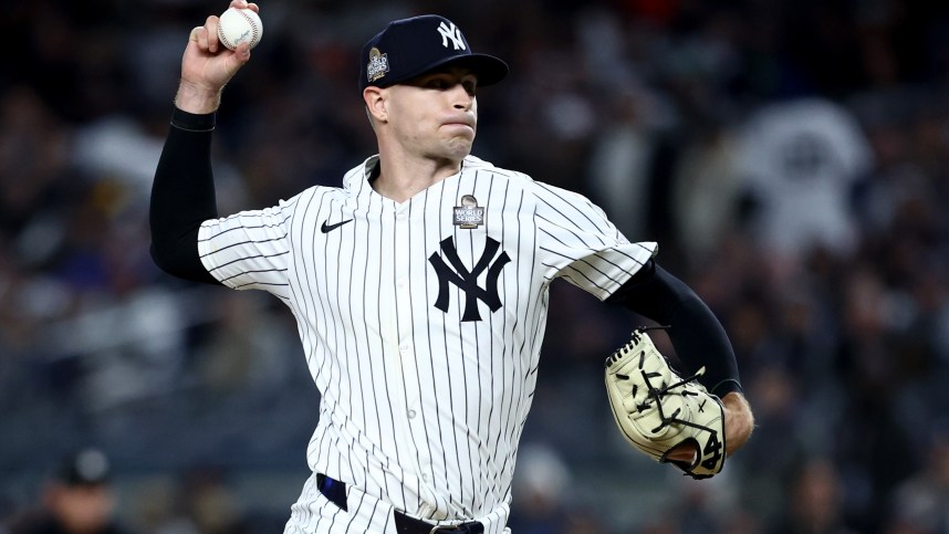 Oct 28, 2024; New York, New York, USA; New York Yankees pitcher Jake Cousins (61) throws during the sixth inning against the Los Angeles Dodgers in game three of the 2024 MLB World Series at Yankee Stadium. Mandatory Credit: Wendell Cruz-Imagn Images