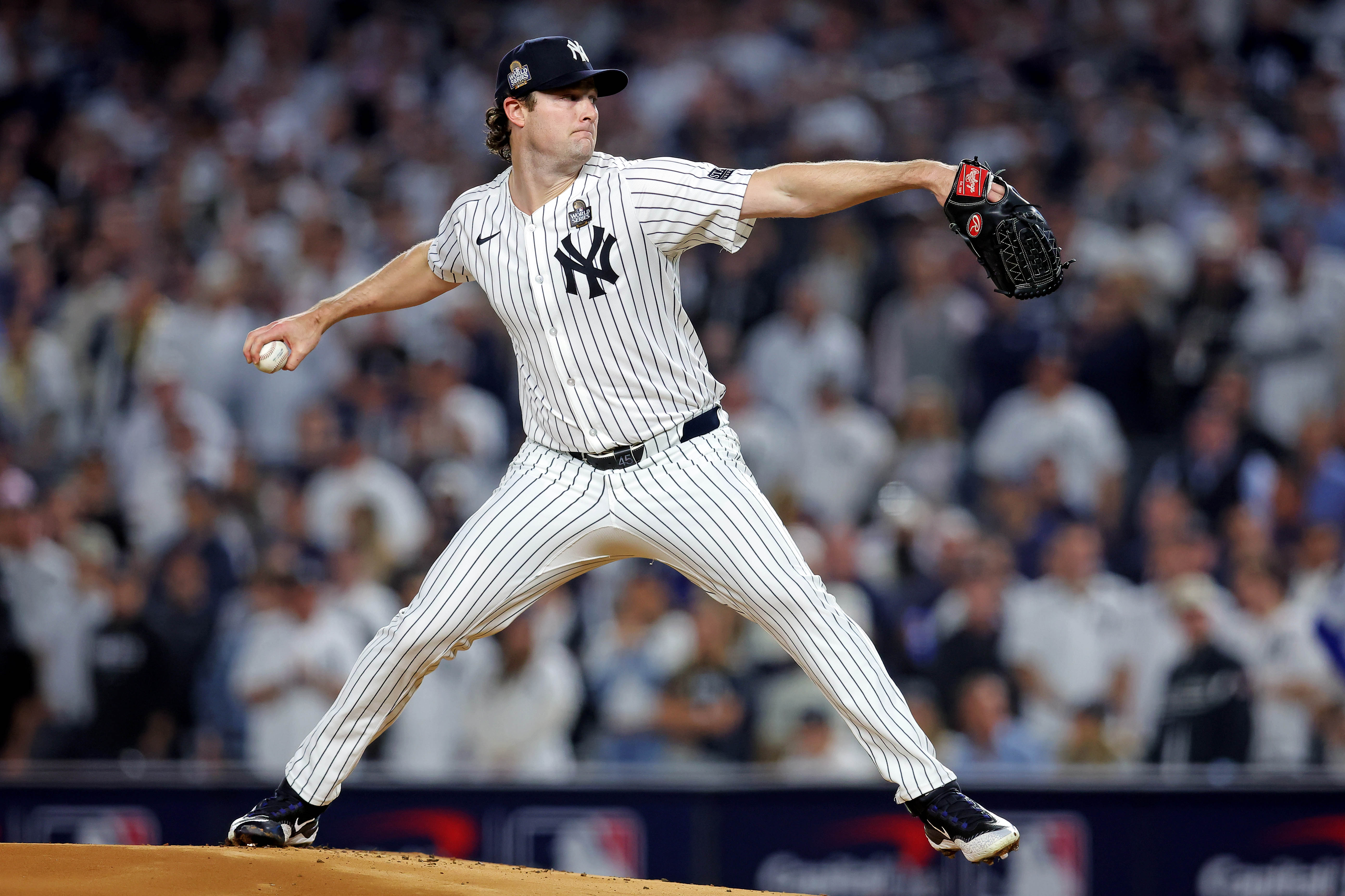 Oct 30, 2024; New York, New York, USA; New York Yankees pitcher Gerrit Cole (45) pitches during the first inning against the Los Angeles Dodgers in game four of the 2024 MLB World Series at Yankee Stadium. Mandatory Credit: Brad Penner-Imagn Images