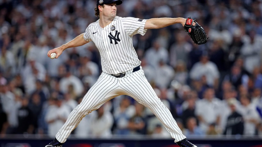 October 30, 2024; New York, New York, USA; New York Yankees pitcher Gerrit Cole (45) pitches during the first inning against the Los Angeles Dodgers in Game 4 of the 2024 MLB World Series at Yankee Stadium. Mandatory credit: Brad Penner-Imagne Images