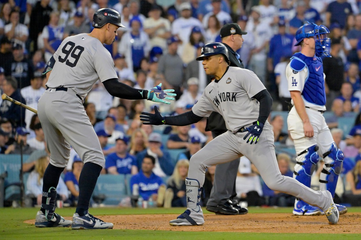 Oct 26, 2024; Los Angeles, California, USA; New York Yankees outfielder Juan Soto (22) celebrates with outfielder Aaron Judge (99) after hitting a solo home run in the third inning against the Los Angeles Dodgers during game two of the 2024 MLB World Series at Dodger Stadium. Mandatory Credit: Jayne Kamin-Oncea-Imagn Images