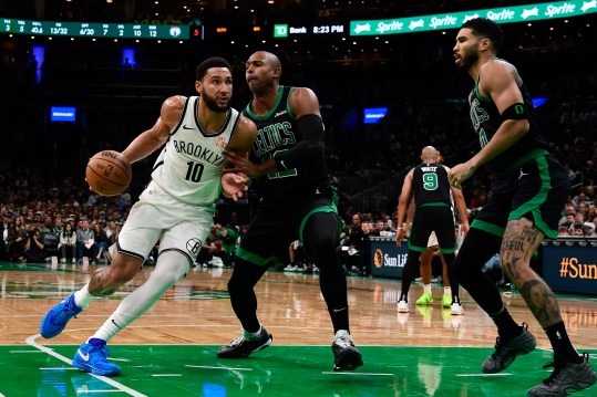 Nov 8, 2024; Boston, Massachusetts, USA;  Brooklyn Nets guard Ben Simmons (10) controls the ball while Boston Celtics center Al Horford (42) defends during the first half at TD Garden. Mandatory Credit: Bob DeChiara-Imagn Images