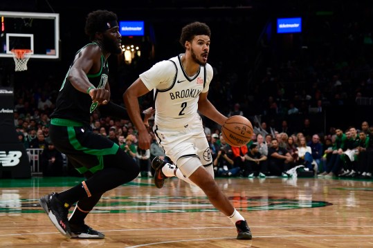 Nov 8, 2024; Boston, Massachusetts, USA;  Brooklyn Nets forward Cameron Johnson (2) controls the ball while Boston Celtics center Neemias Queta (88) defends during the first half at TD Garden. Mandatory Credit: Bob DeChiara-Imagn Images