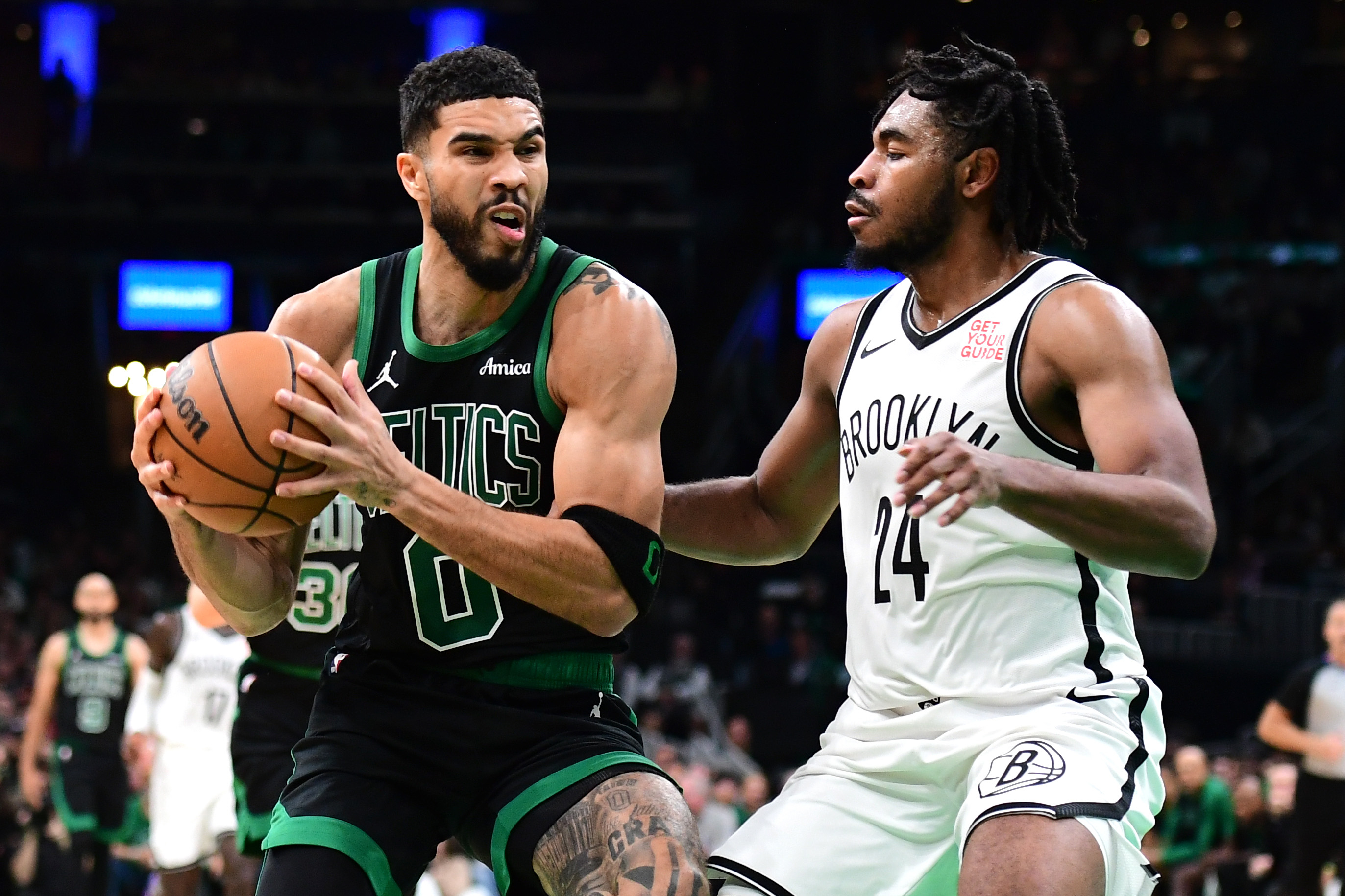 Nov 8, 2024; Boston, Massachusetts, USA;  Boston Celtics forward Jayson Tatum (0) controls the ball while Brooklyn Nets guard Cam Thomas (24) defends during the second half at TD Garden. Mandatory Credit: Bob DeChiara-Imagn Images