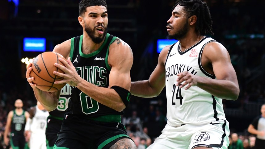 Nov 8, 2024; Boston, Massachusetts, USA;  Boston Celtics forward Jayson Tatum (0) controls the ball while Brooklyn Nets guard Cam Thomas (24) defends during the second half at TD Garden. Mandatory Credit: Bob DeChiara-Imagn Images