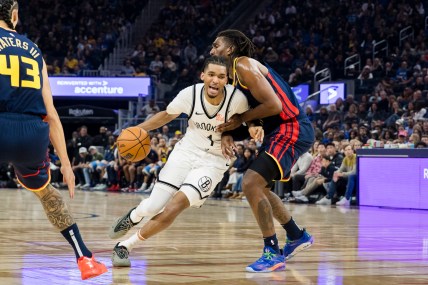 Nov 25, 2024; San Francisco, California, USA; Golden State Warriors forward Kevon Looney (5) defen3ds Brooklyn Nets forward Ziaire Williams (1) during the first half at Chase Center. Mandatory Credit: John Hefti-Imagn Images