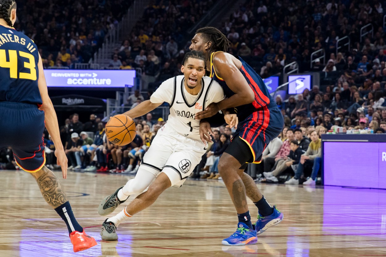 Nov 25, 2024; San Francisco, California, USA; Golden State Warriors forward Kevon Looney (5) defen3ds Brooklyn Nets forward Ziaire Williams (1) during the first half at Chase Center. Mandatory Credit: John Hefti-Imagn Images