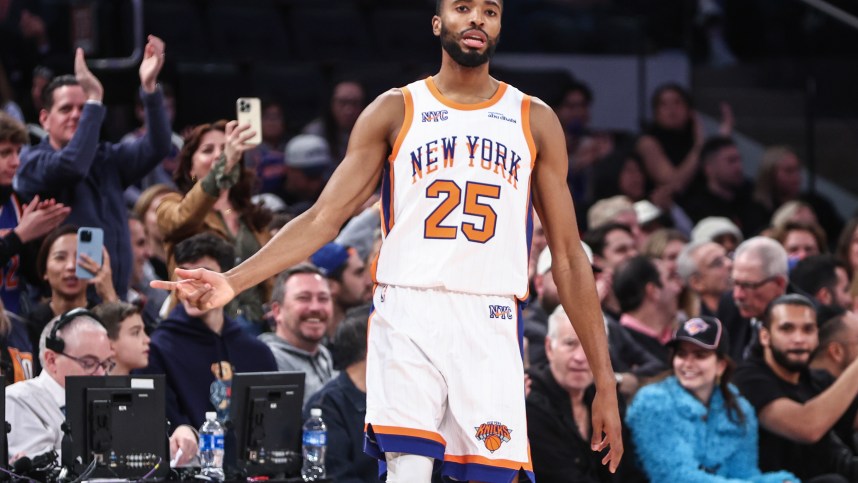 Nov 17, 2024; New York, New York, USA;  New York Knicks forward Mikal Bridges (25) gestures after making a three-point shot in the second quarter against the Brooklyn Nets at Madison Square Garden. Mandatory Credit: Wendell Cruz-Imagn Images