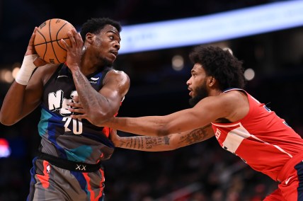 Mar 27, 2024; Washington, District of Columbia, USA;  Brooklyn Nets center Day'Ron Sharpe (20) looks to pass as Washington Wizards forward Marvin Bagley III (35) defends during the first half at Capital One Arena. Mandatory Credit: Tommy Gilligan-Imagn Images