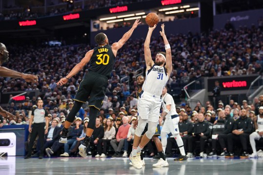 Nov 12, 2024; San Francisco, California, USA; Dallas Mavericks guard Klay Thompson (31) shoots over Golden State Warriors guard Stephen Curry (30) in the second quarter at the Chase Center. Mandatory Credit: Cary Edmondson-Imagn Images