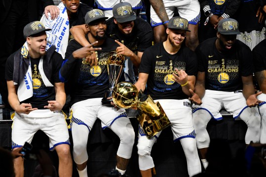 Jun 8, 2018; Cleveland, OH, USA; Golden State Warriors guard Klay Thompson (left) and forward Kevin Durant (middle) and guard Stephen Curry (right) celebrate after defeating the Cleveland Cavaliers in game four of the 2018 NBA Finals at Quicken Loans Arena. Mandatory Credit: David Richard-Imagn Images