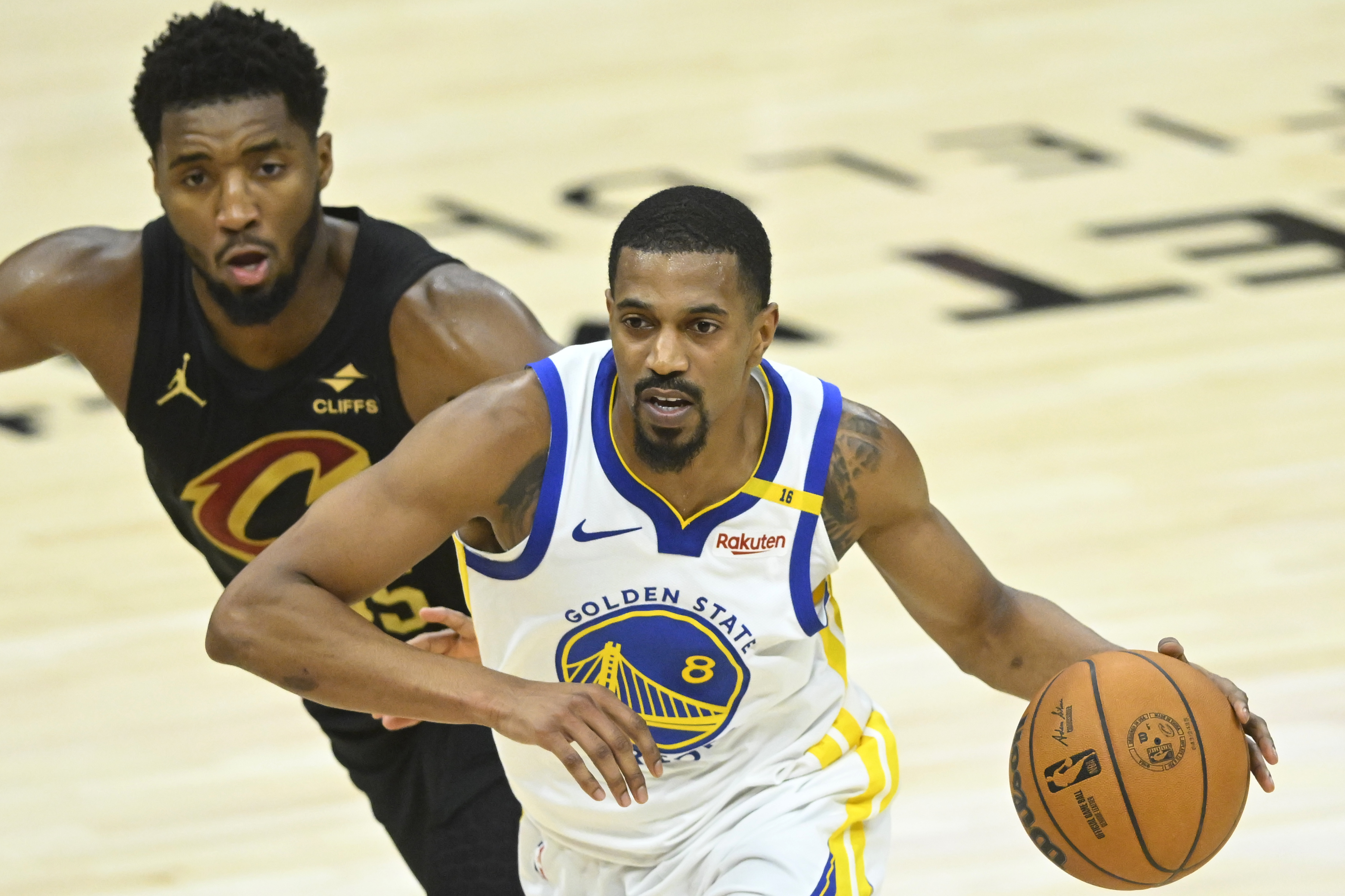 Nov 8, 2024; Cleveland, Ohio, USA; Golden State Warriors guard De'Anthony Melton (8) drives beside Cleveland Cavaliers guard Donovan Mitchell (45) in the fourth quarter at Rocket Mortgage FieldHouse. Mandatory Credit: David Richard-Imagn Images