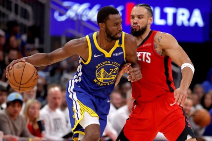 Nov 2, 2024; Houston, Texas, USA; Golden State Warriors forward Andrew Wiggins (22) handles the ball against Houston Rockets forward Dillon Brooks (9) during the third quarter at Toyota Center. Mandatory Credit: Erik Williams-Imagn Images