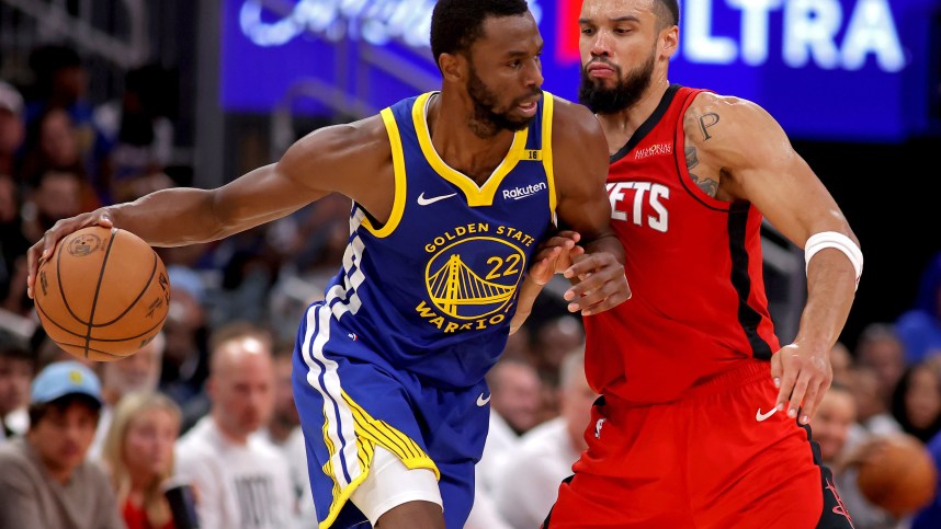 Nov 2, 2024; Houston, Texas, USA; Golden State Warriors forward Andrew Wiggins (22) handles the ball against Houston Rockets forward Dillon Brooks (9) during the third quarter at Toyota Center. Mandatory Credit: Erik Williams-Imagn Images